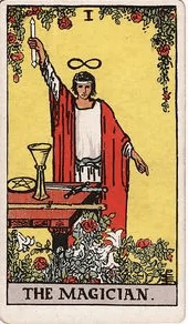 A magician stands at a table holding a wand aloft, a cup, sword, and pentacle laid before him, an infinity symbol above his head.
