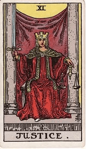 A crowned figure sits between two grey pillars holding an upright sword in one hand and a balanced scale in the other.